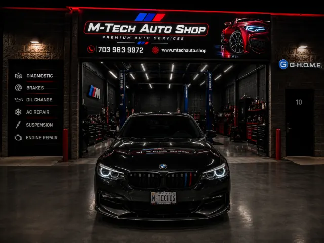 BMW centered inside the illuminated M-Tech Auto Shop garage